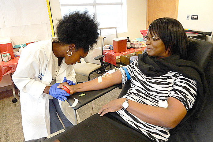 Scotiabank employees donate blood during the Bank’s corporate blood drive. 